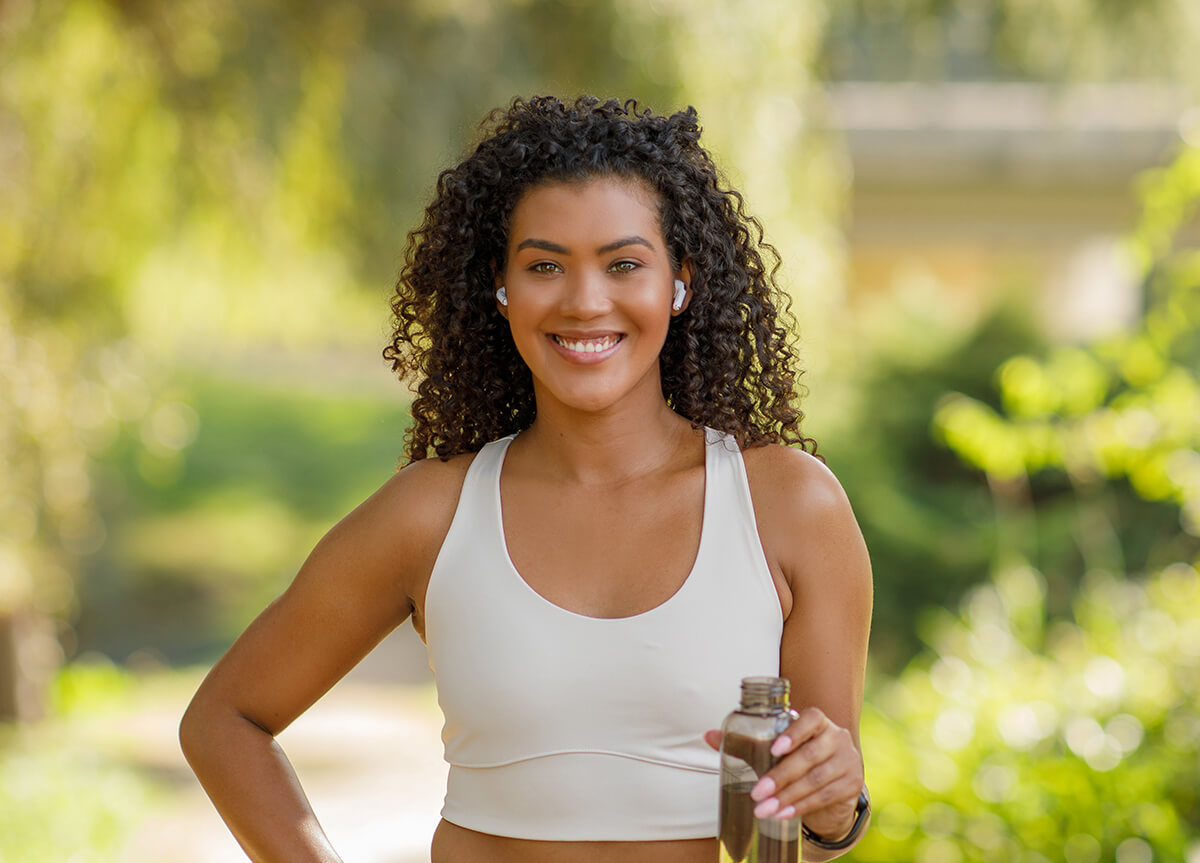 athletic-lady-with-earbuds-in-sportswear-holding-w-2025-03-18-18-52-03-utc (1)